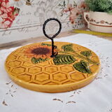 Vintage yellow earthenware cheese dish with sunflower decor and wrought iron handle