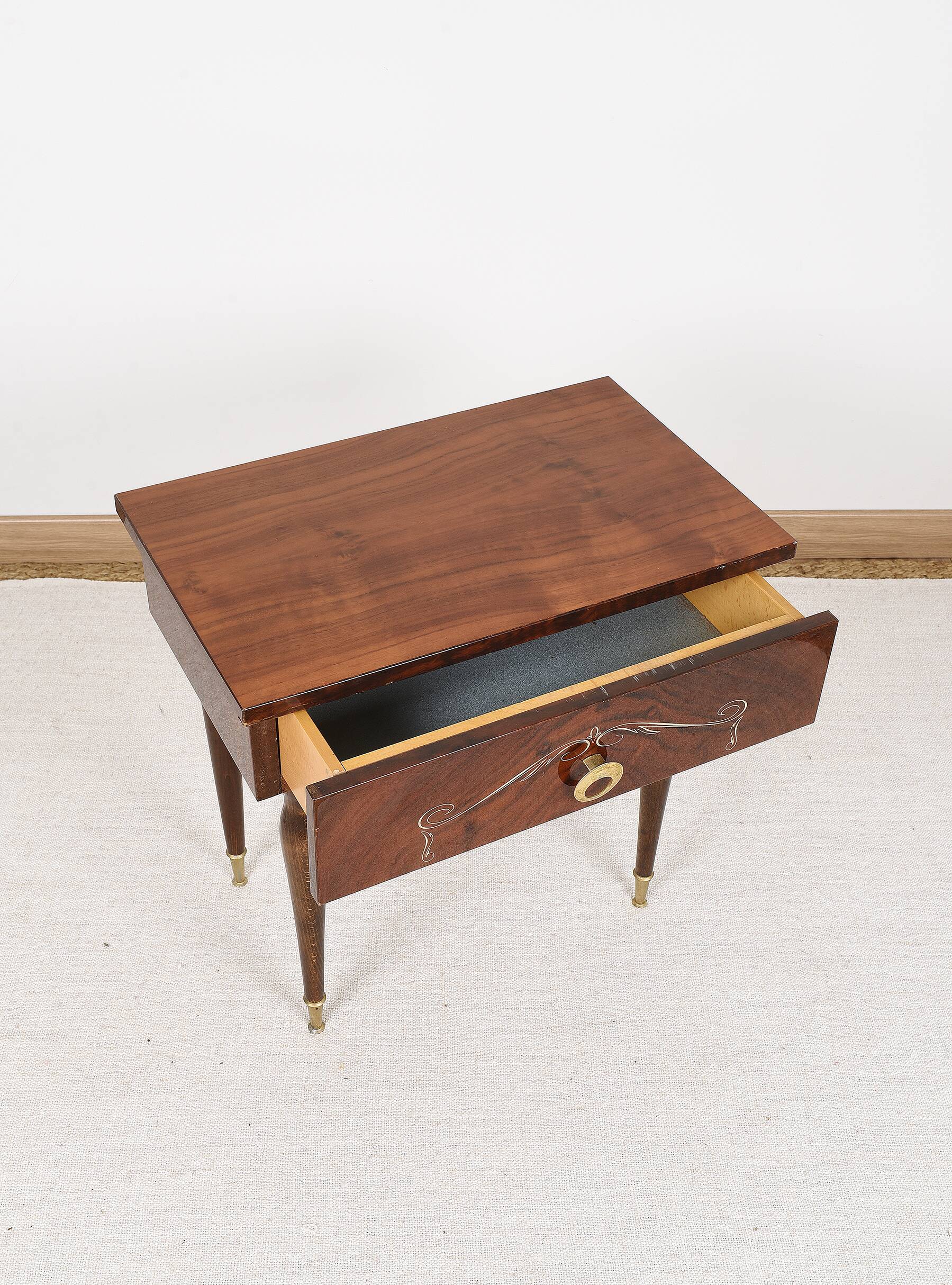Vintage bedside table from the 70s in varnished wood.