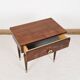Vintage bedside table from the 70s in varnished wood.