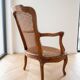 Low Louis XV armchair in wood and cane