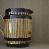 Striped pitcher and inscription