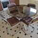 Round kitchen table with smoked glass top and 4 chairs from the 1970s.