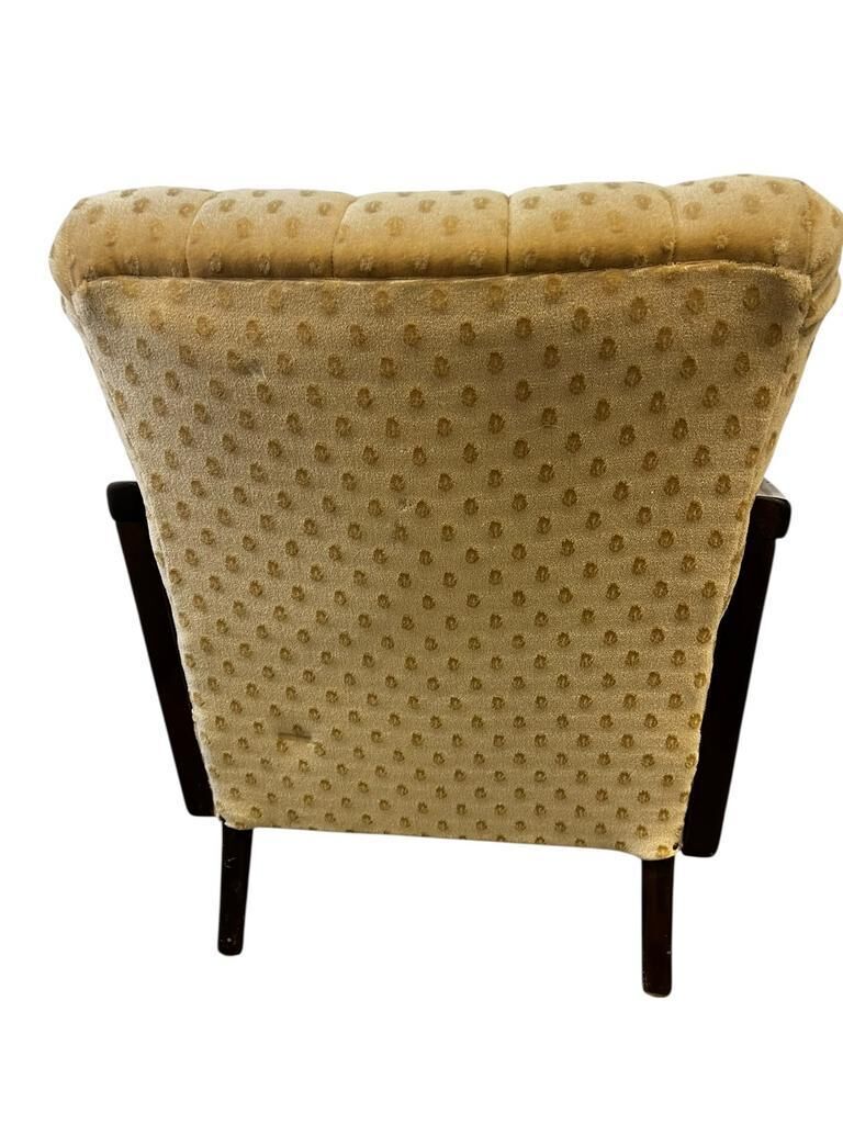 Vintage wooden armchair with rattan weaving.