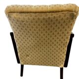 Vintage wooden armchair with rattan weaving.