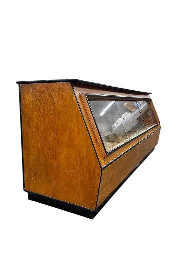 Vintage wooden shop counter with display case