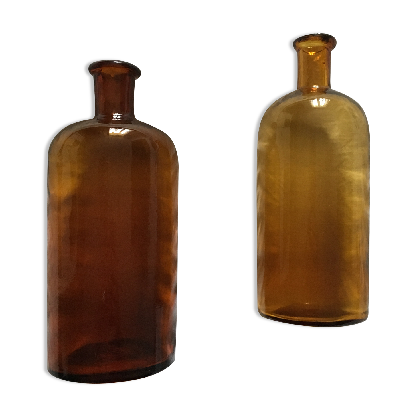 Duo of amber apothecary bottles