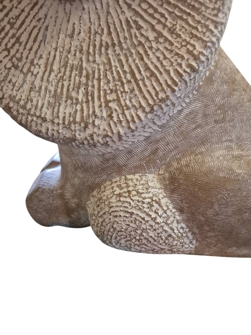 Sculpture of a lion in stone by Islay Grimes.