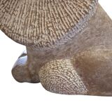 Sculpture of a lion in stone by Islay Grimes.