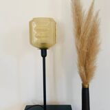 Table lamp with a yellow shade in vintage art deco style