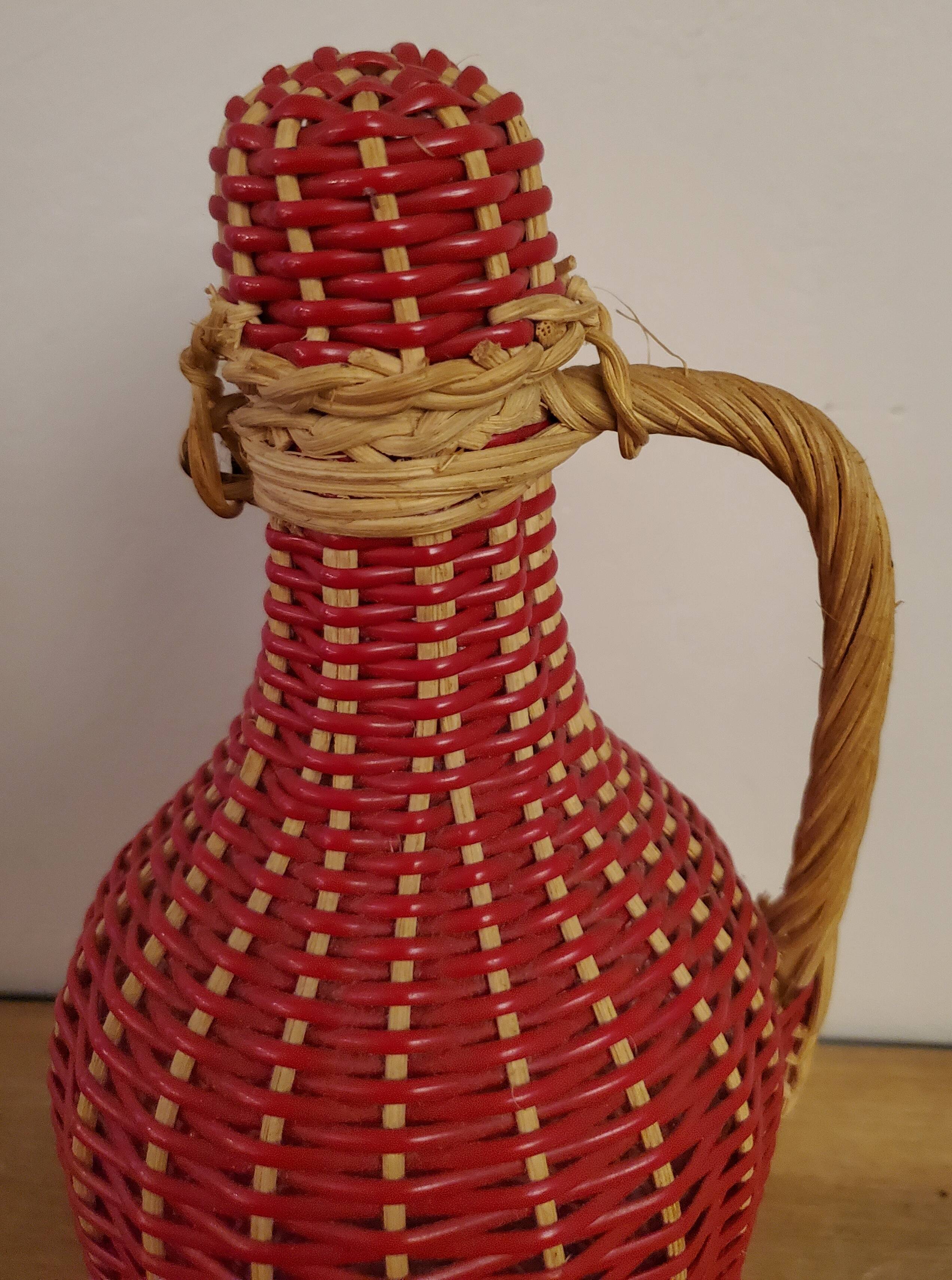 Glass bottle and rattan and scoubidou braiding 1960