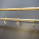 Art-deco wall-mounted coat rack in brass