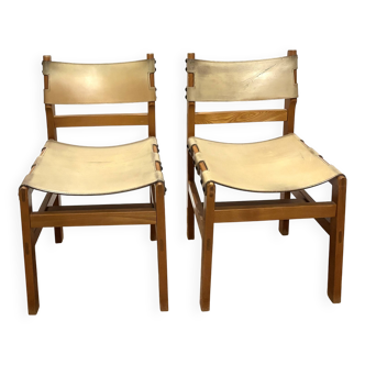 Pair of Maison Regain leather chairs