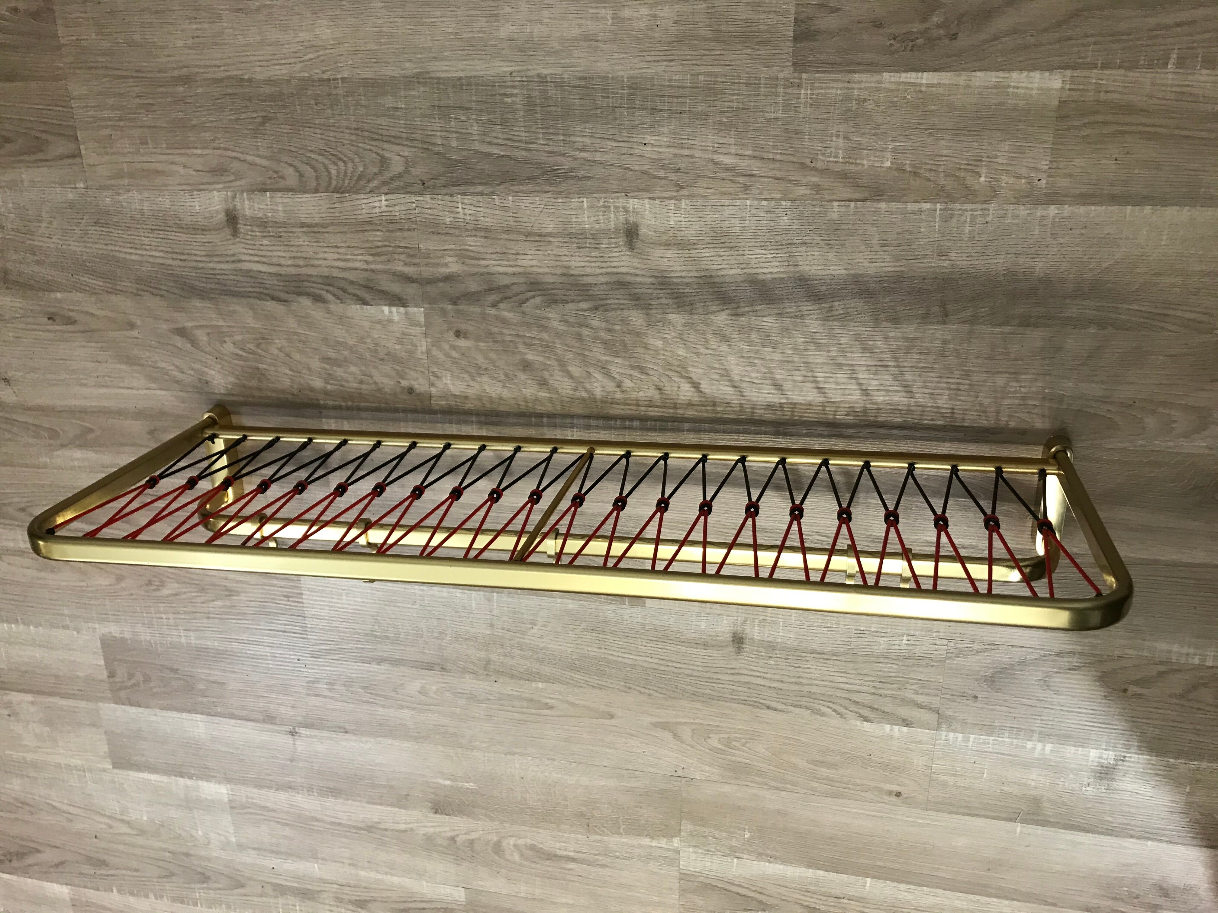 Coat rack with scoubidou shelf