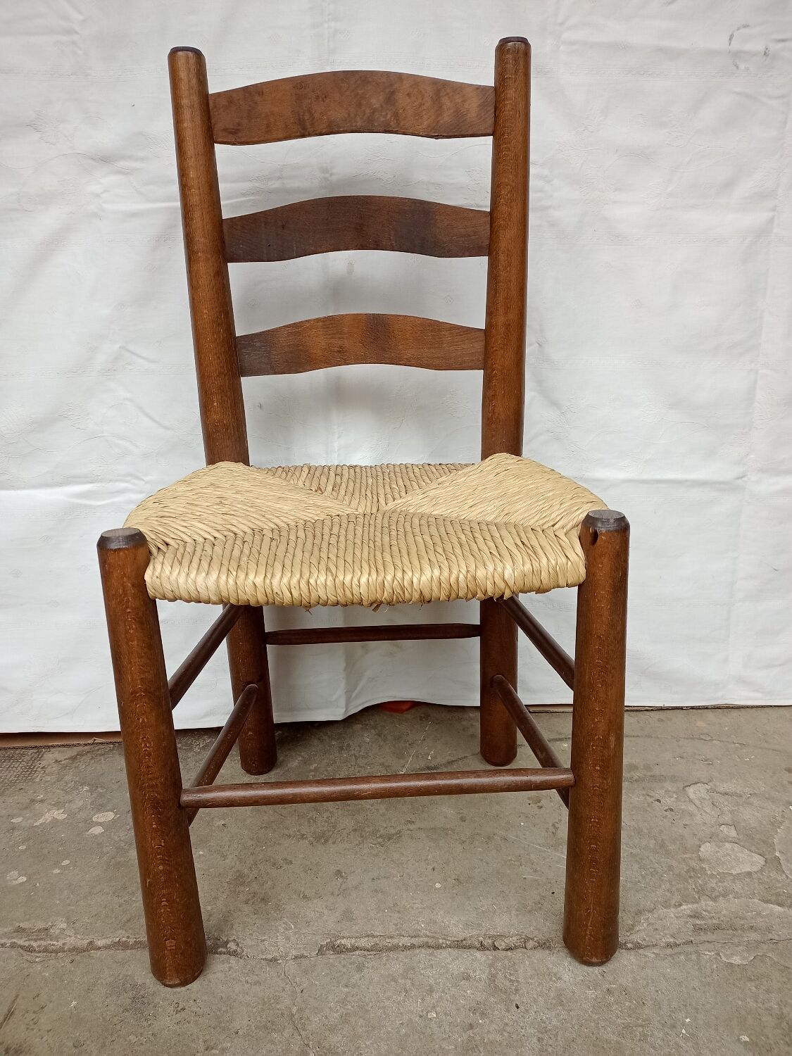 Brutalist chairs in walnut and straw