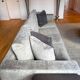 3-seater PMP Classy sofa in grey fabric and its 4 PMP cushions.
