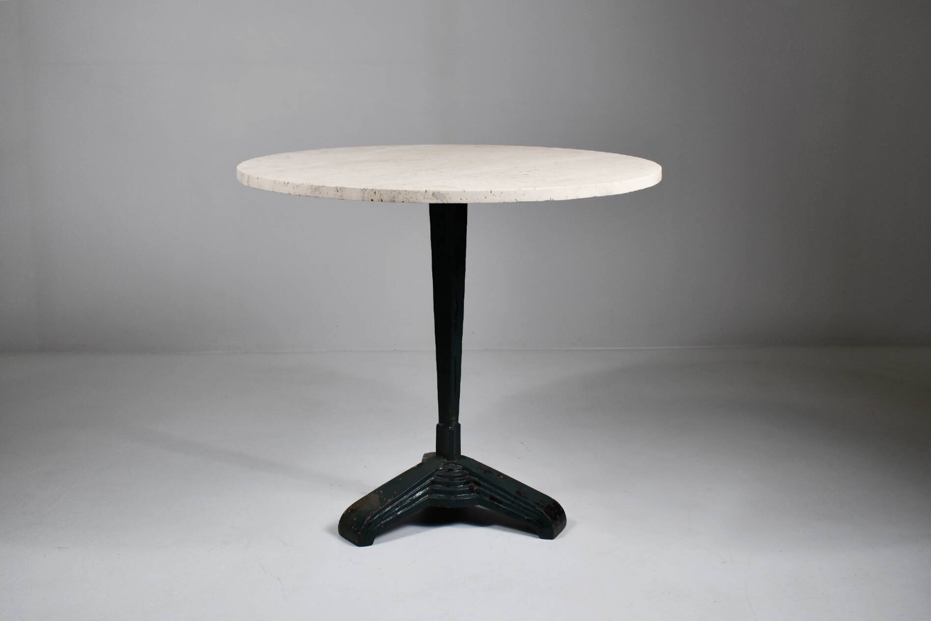 Vintage travertine bistro/dining table with metal base. (B)