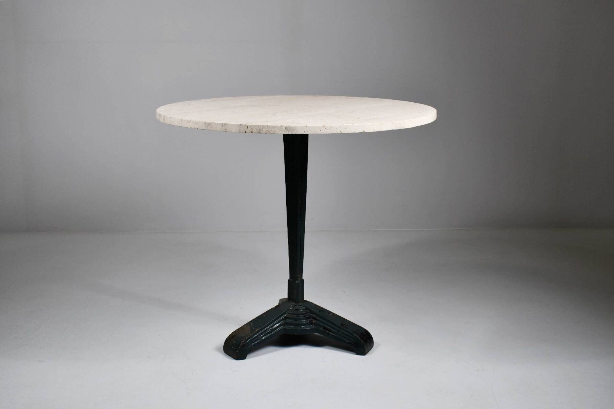 Vintage travertine bistro/dining table with metal base. (B)
