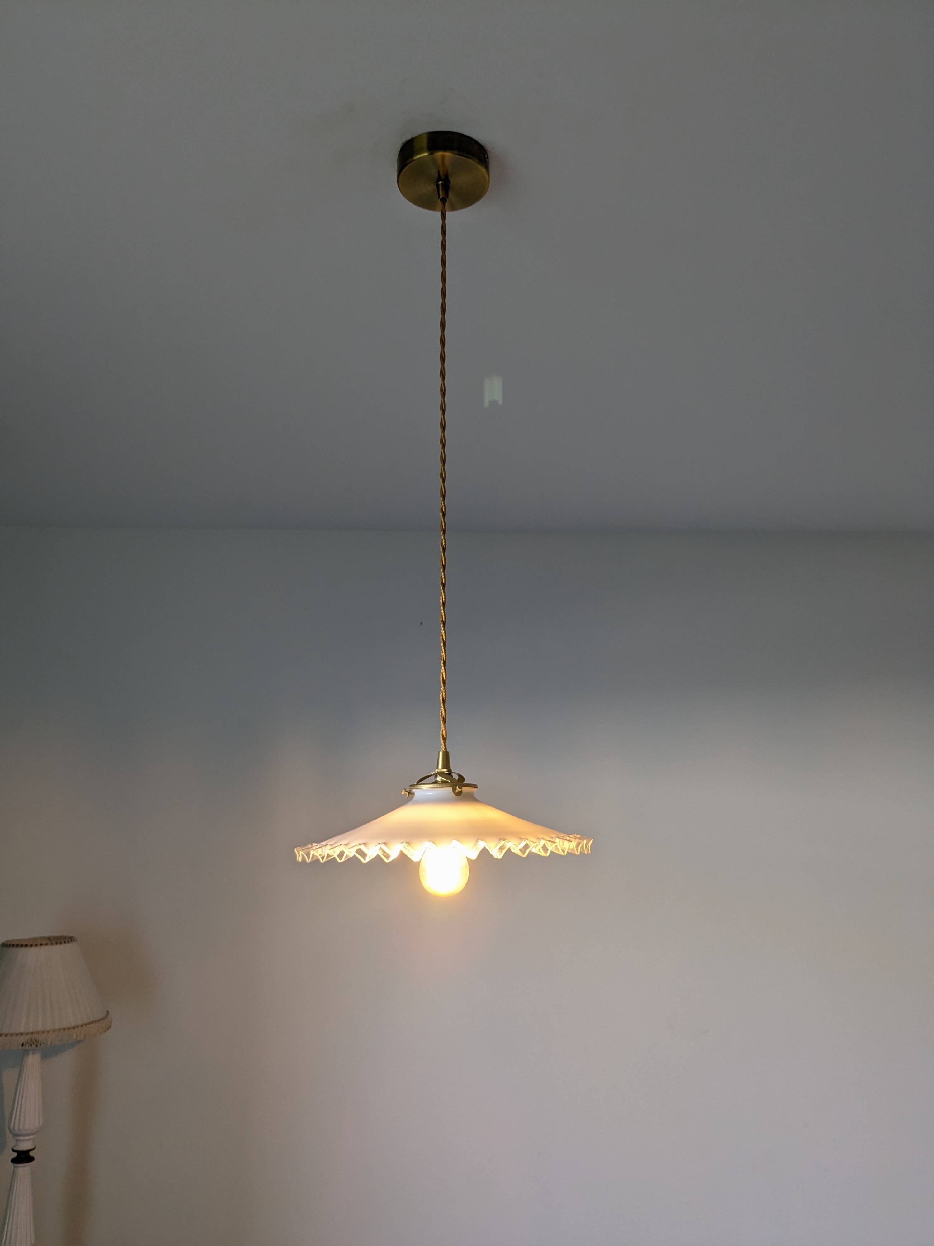 Vintage suspension in lace opaline, elegant light fixture with soft light.