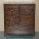 Large vintage hardwood furniture in military country style.