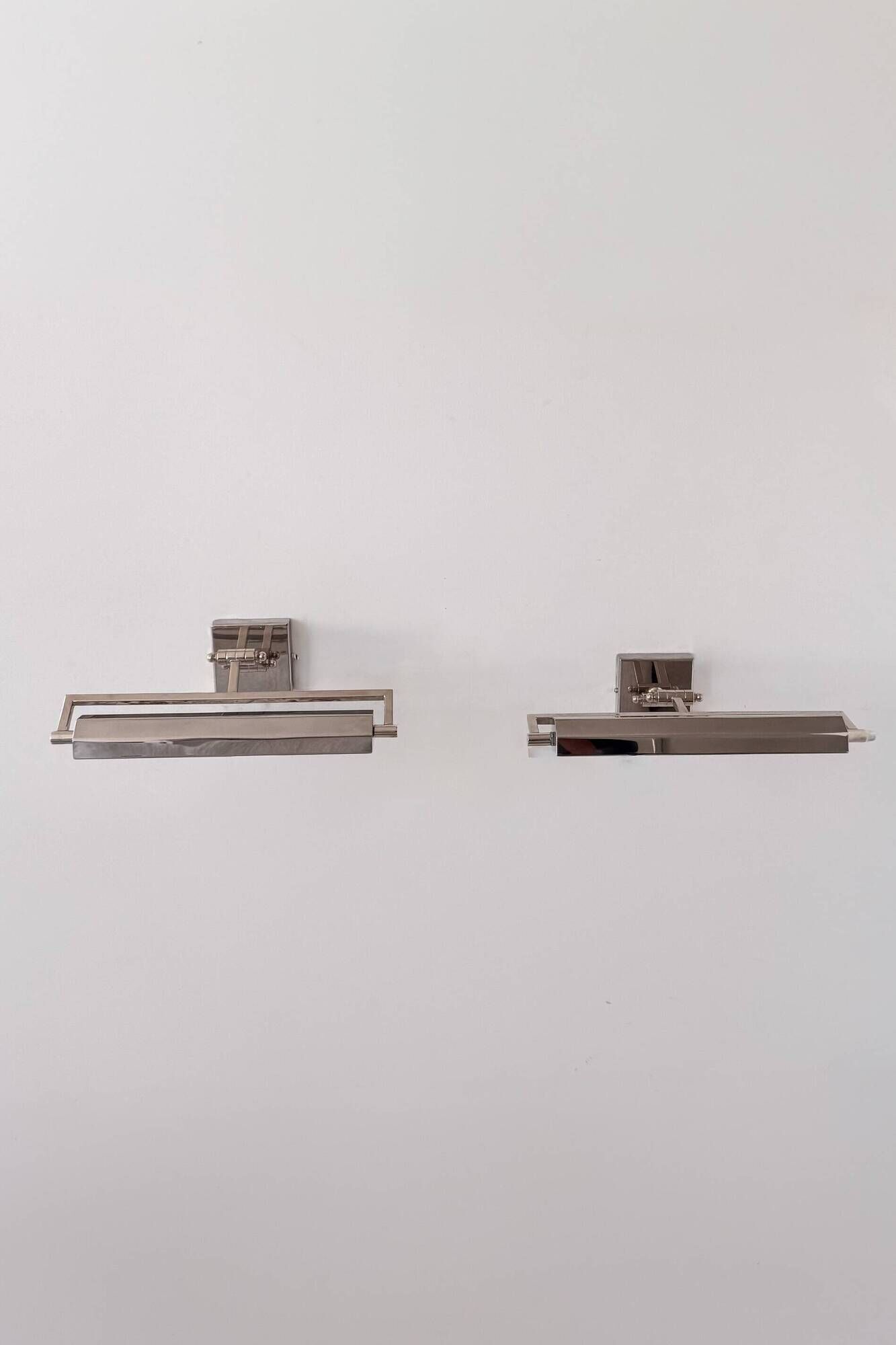 Pair of vintage geometric adjustable wall lights in chrome metal, France 70s.