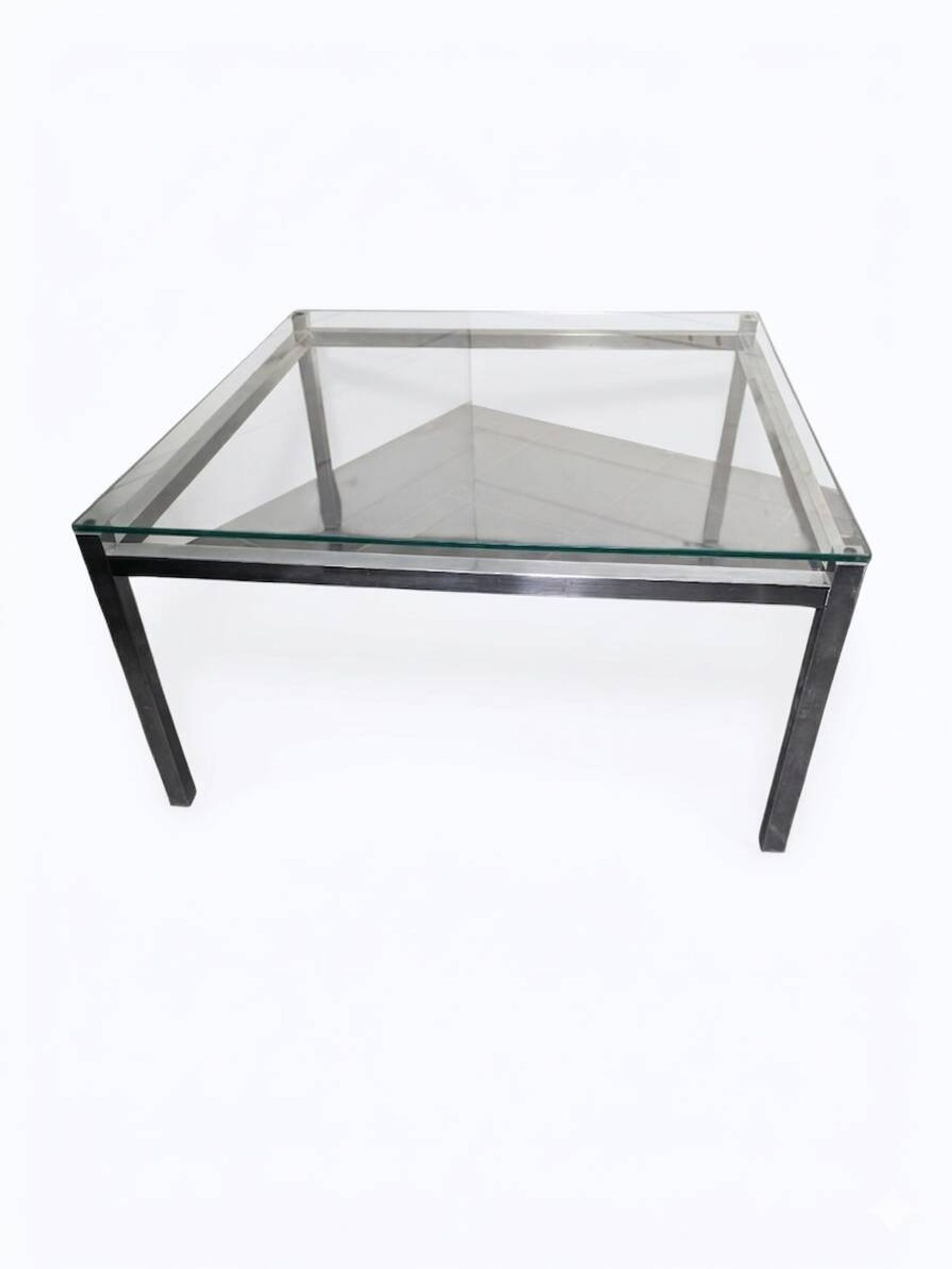Chrome metal coffee table with a glass top from the 1970s.