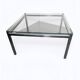 Chrome metal coffee table with a glass top from the 1970s.