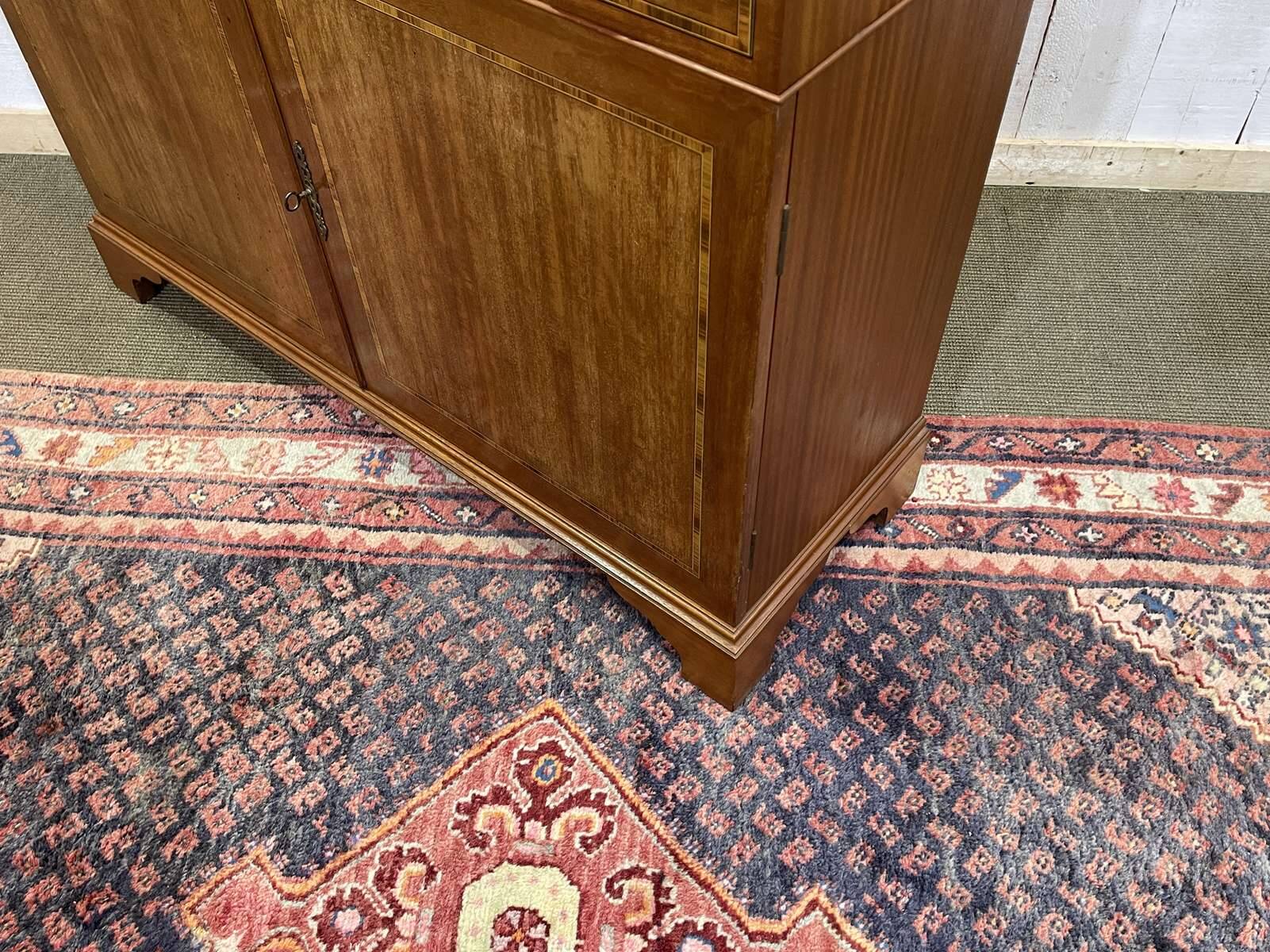 English two-piece mahogany bookcase from the 1950s