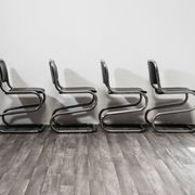 Ensemble de 4 chaises à bascule en acier chromé design années 80 vintage moderne.
