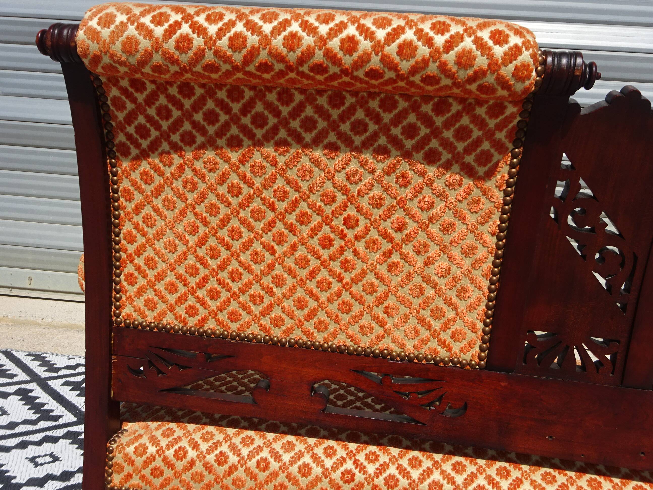 Old wooden and velvet bench