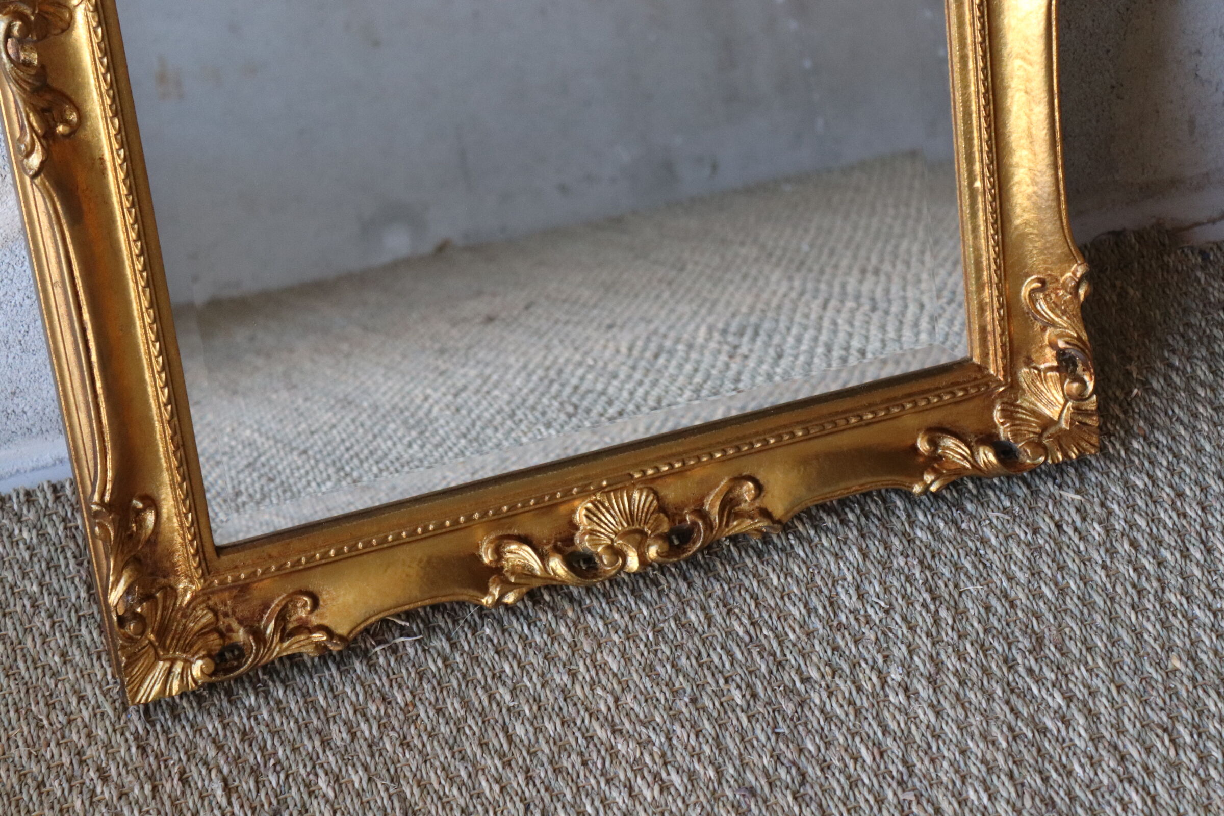 Bevelled gilded wood mirror