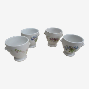 Set of 4 decorated porcelain pots with shells