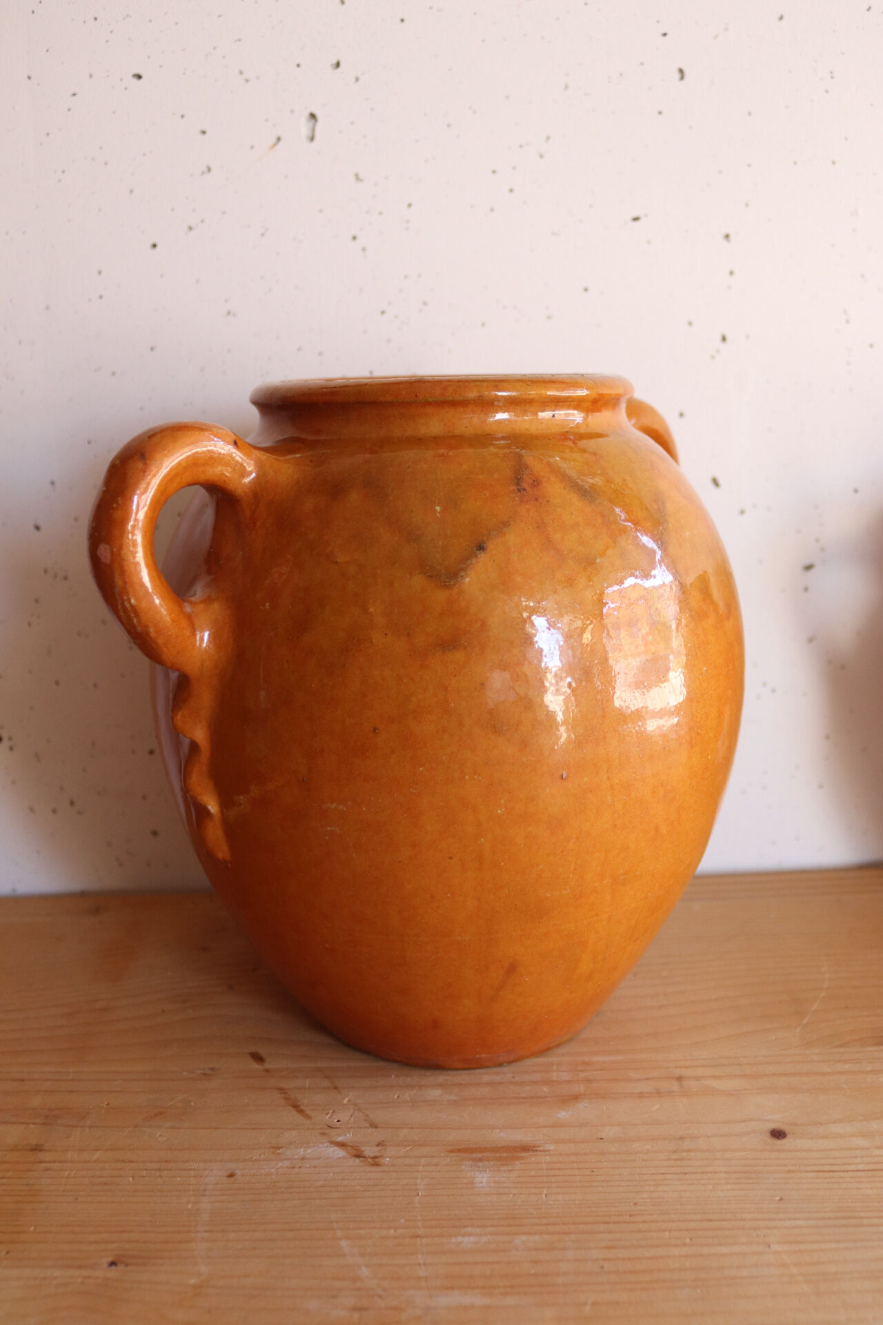 Old honey-glazed pot with two handles