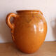 Old honey-glazed pot with two handles