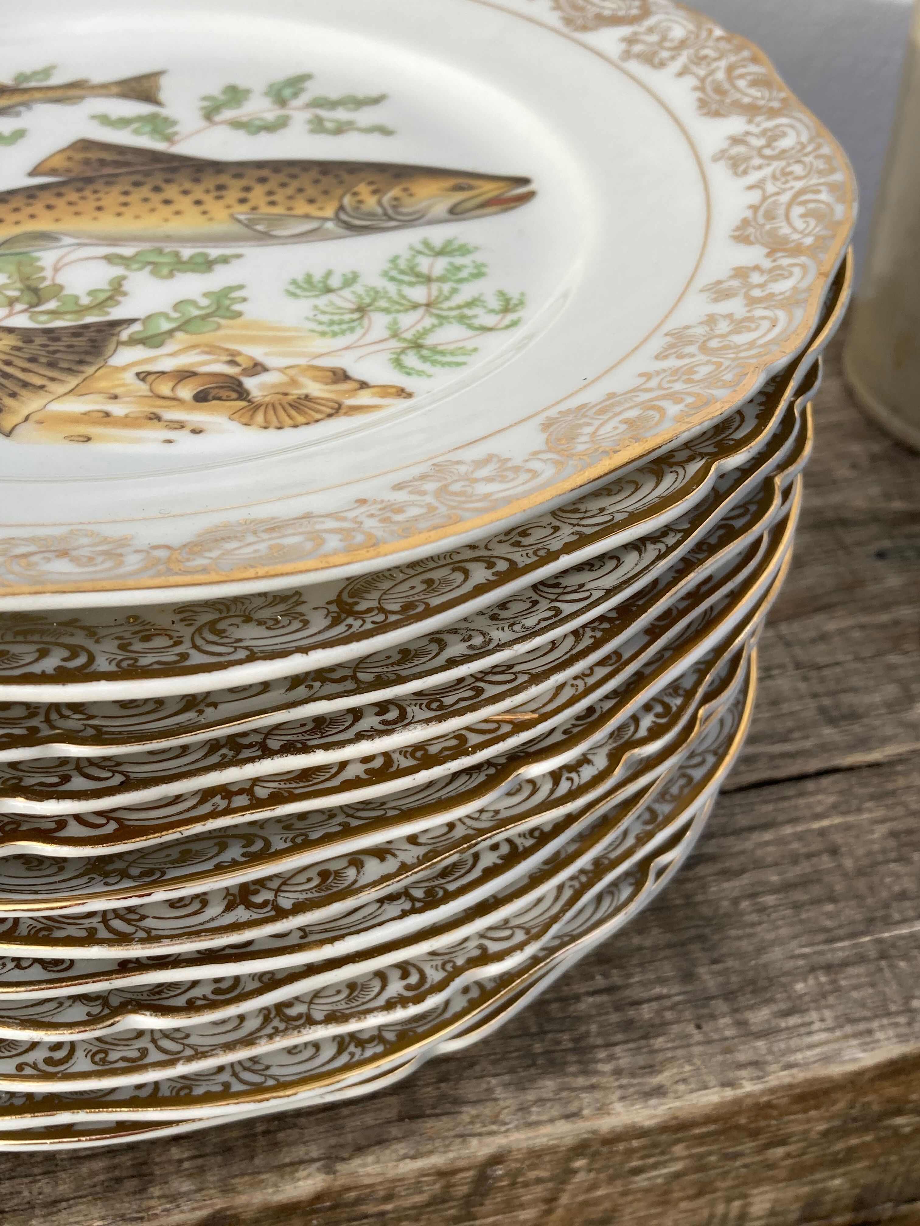 11 vintage Limoges porcelain fish plates
