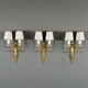 Set of three Louis XVI style wall sconces in gilded bronze, 20th century.