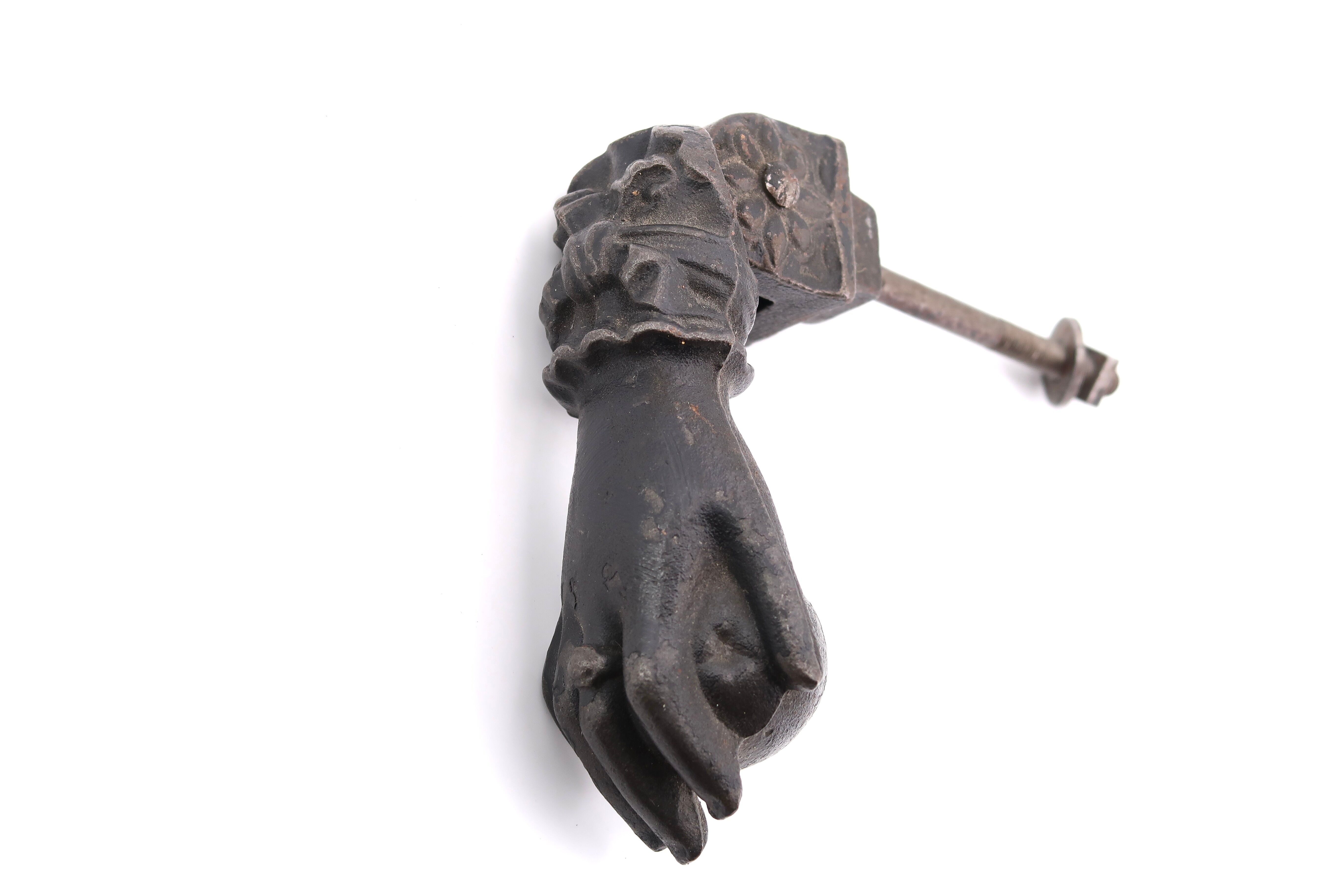 Hand-shaped metal door knocker, 1930s