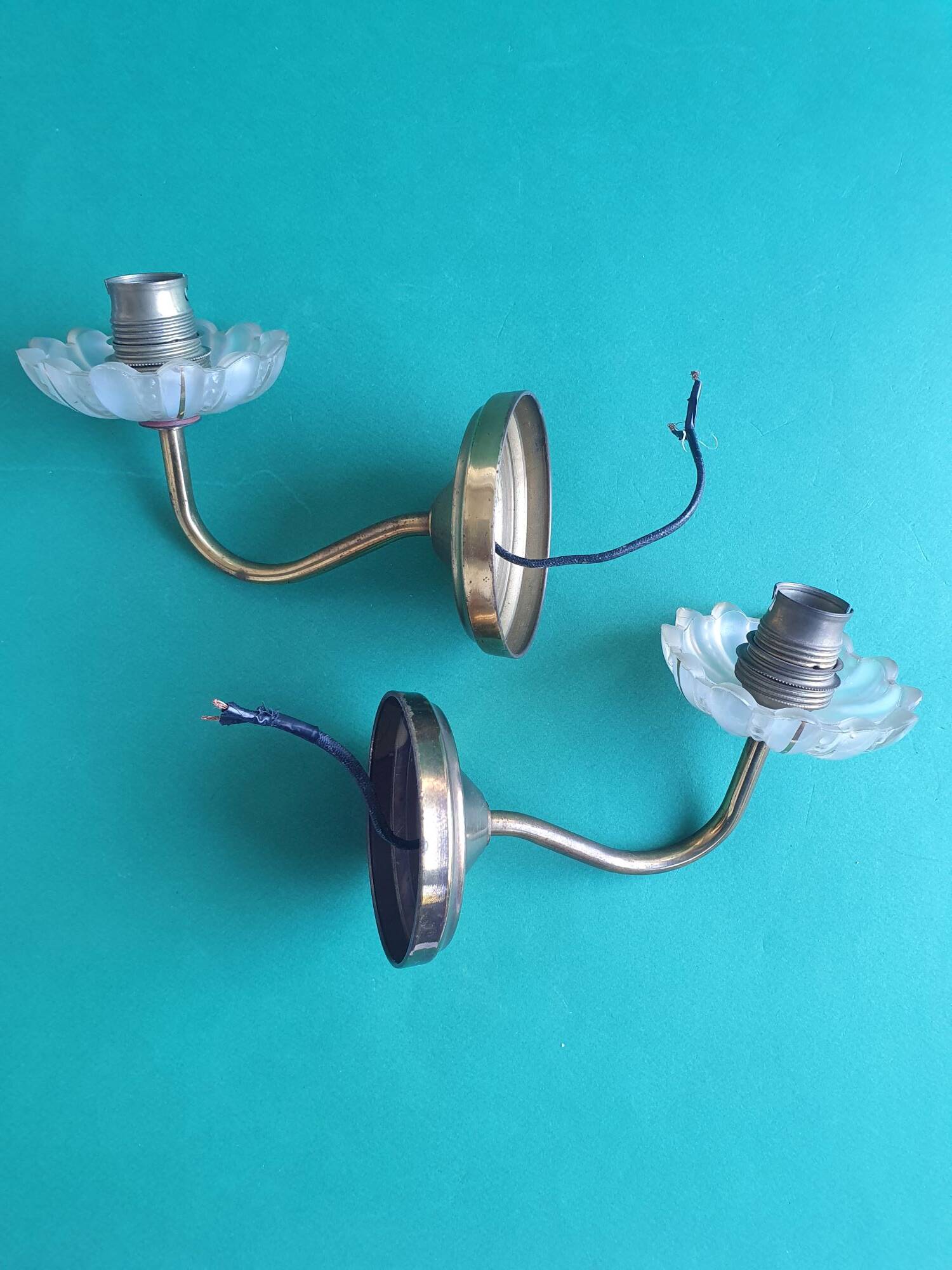 Pair of antique gold candlestick wall sconces