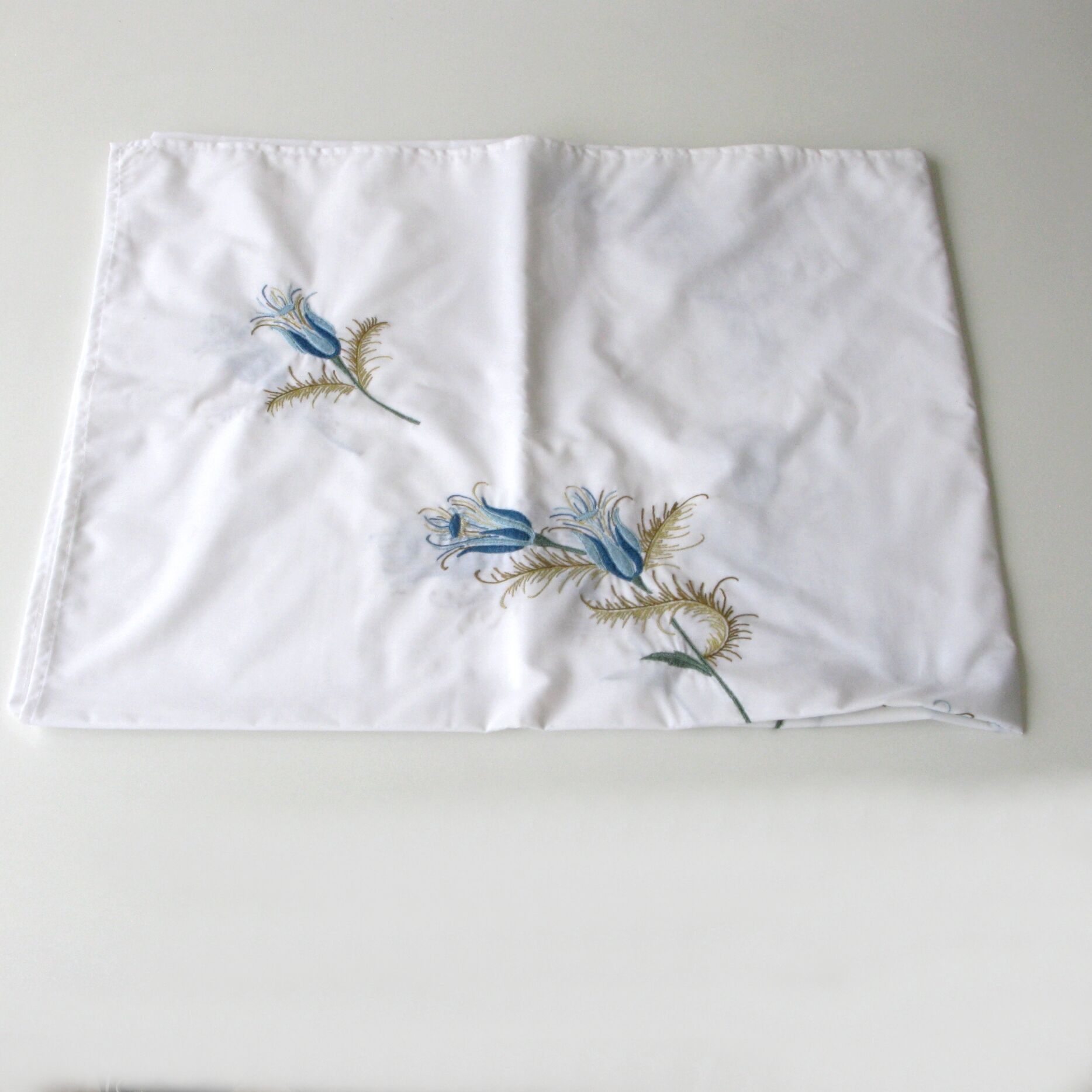 Antique rectangular hand-embroidered tablecloth decorated with thistle and 12 towels