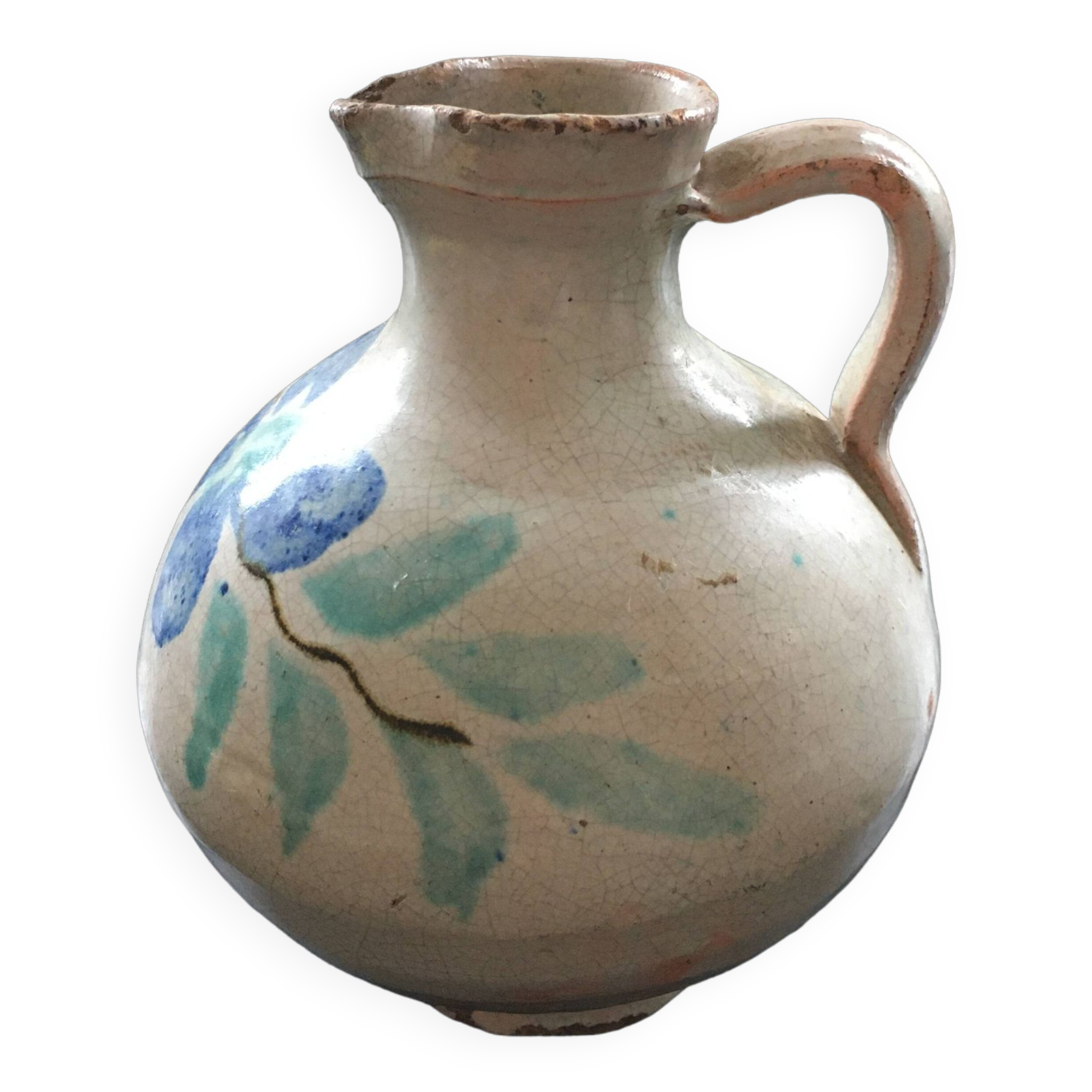 Antique pitcher with floral decoration