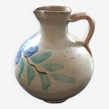 Old pitcher with floral decoration