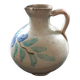 Antique pitcher with floral decoration