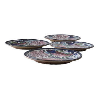 4 colorful flat plates with a fish pattern