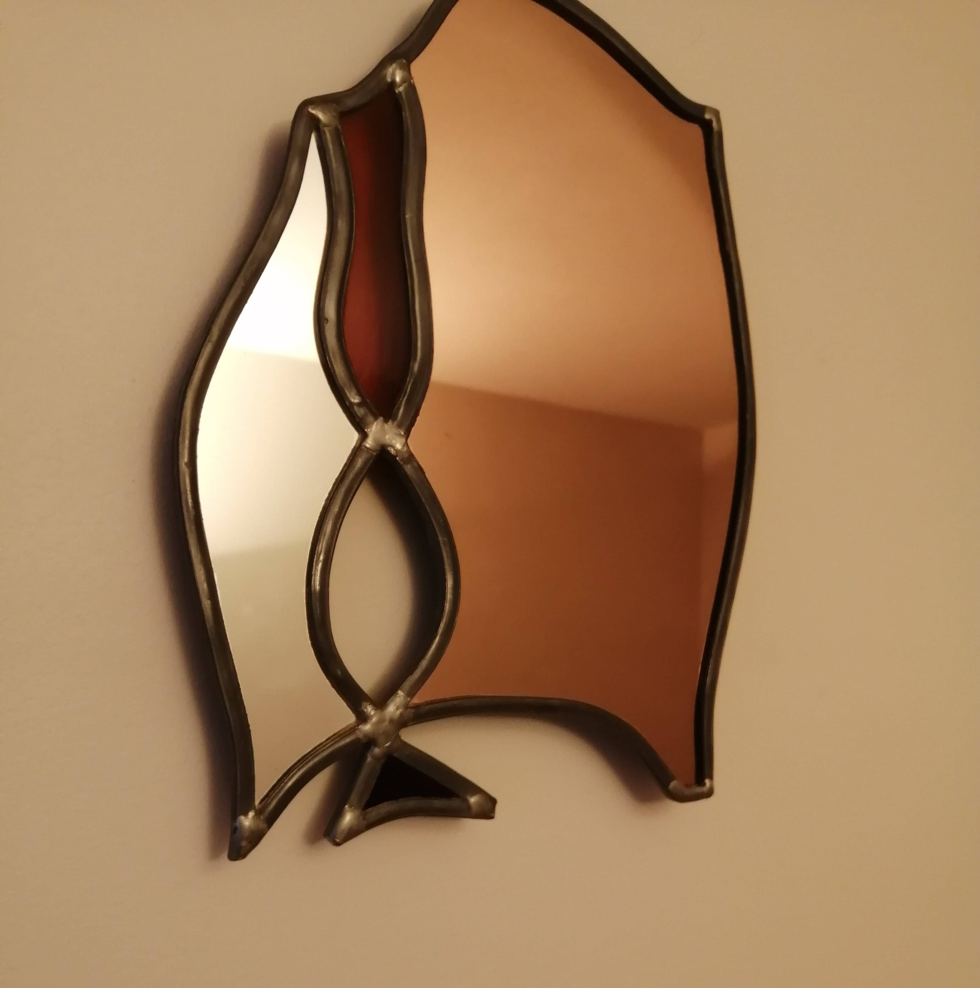 Handcrafted stained glass combining mirrors and glass, cloisonné on metal (Paris).