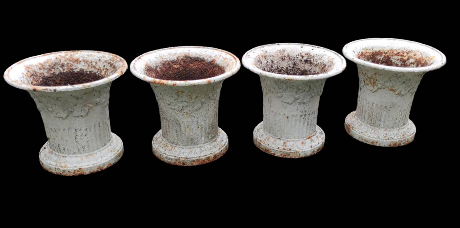 Series of 4 old cast iron vases
