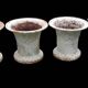 Series of 4 old cast iron vases