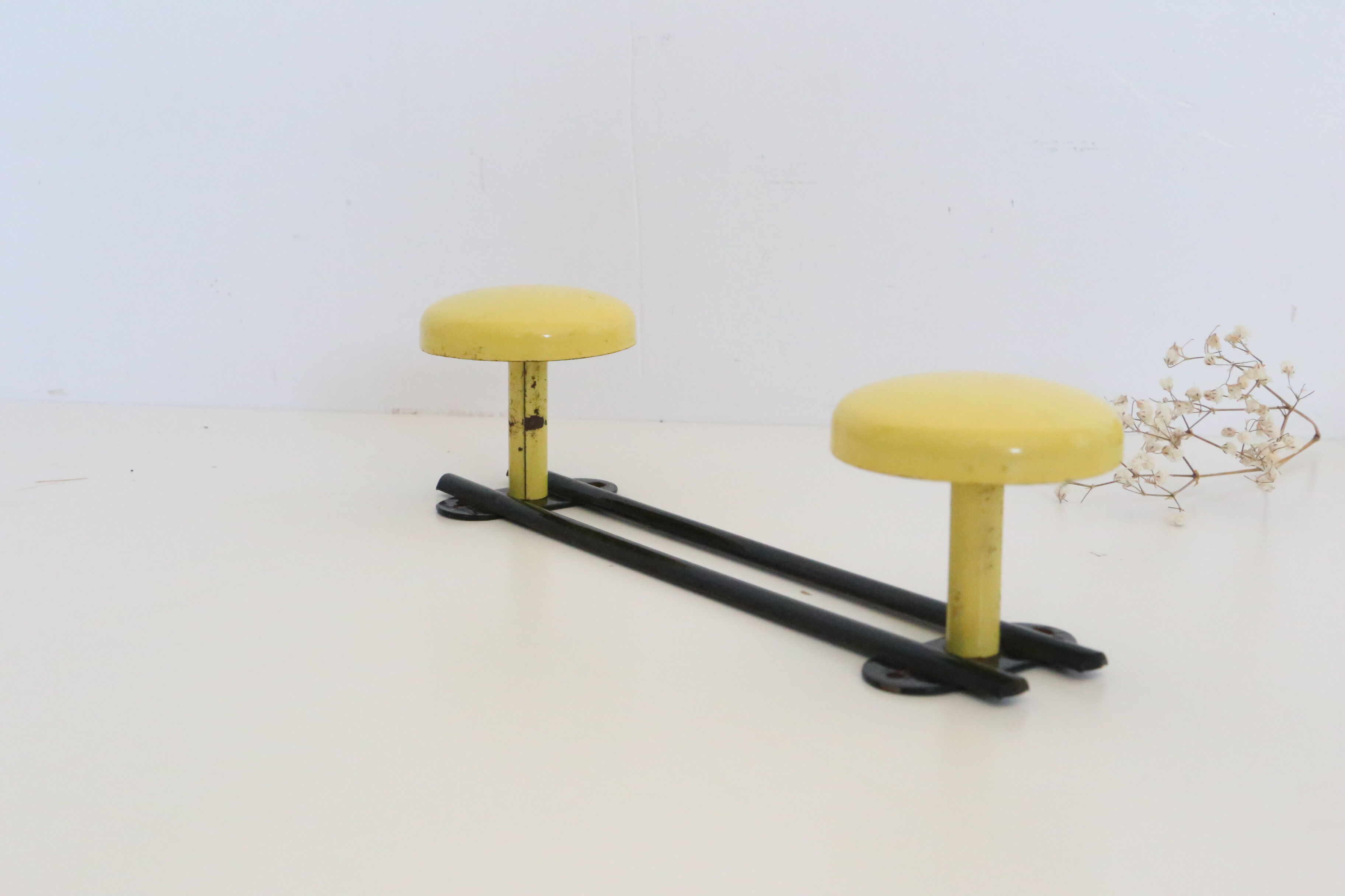 Wall coat rack in yellow and black metal, vintage