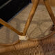 Vintage rattan baby cot on wheels.