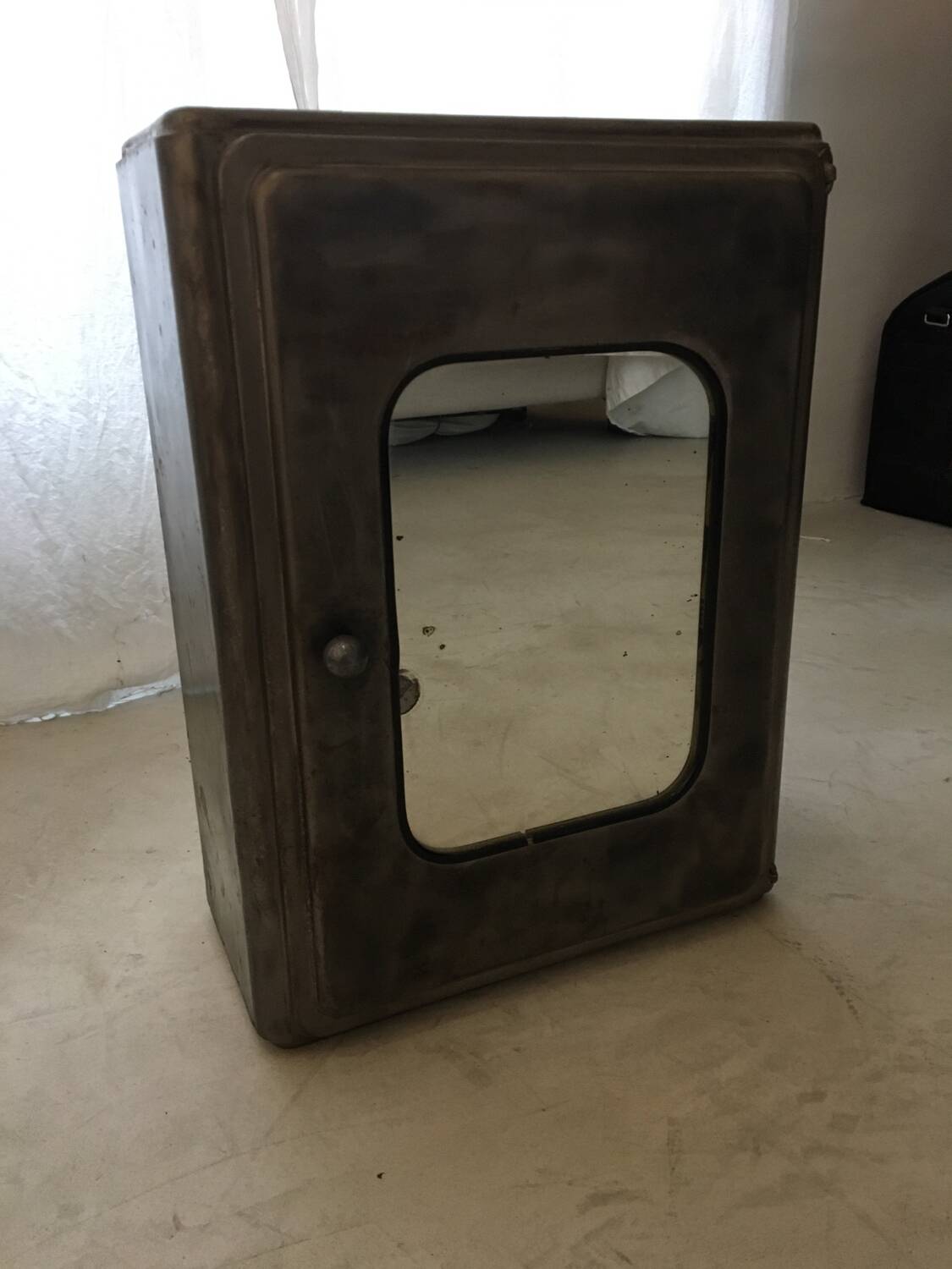 Gray metal medicine cabinet