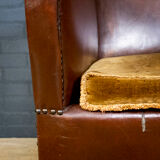 Antique club armchair of leather cloth