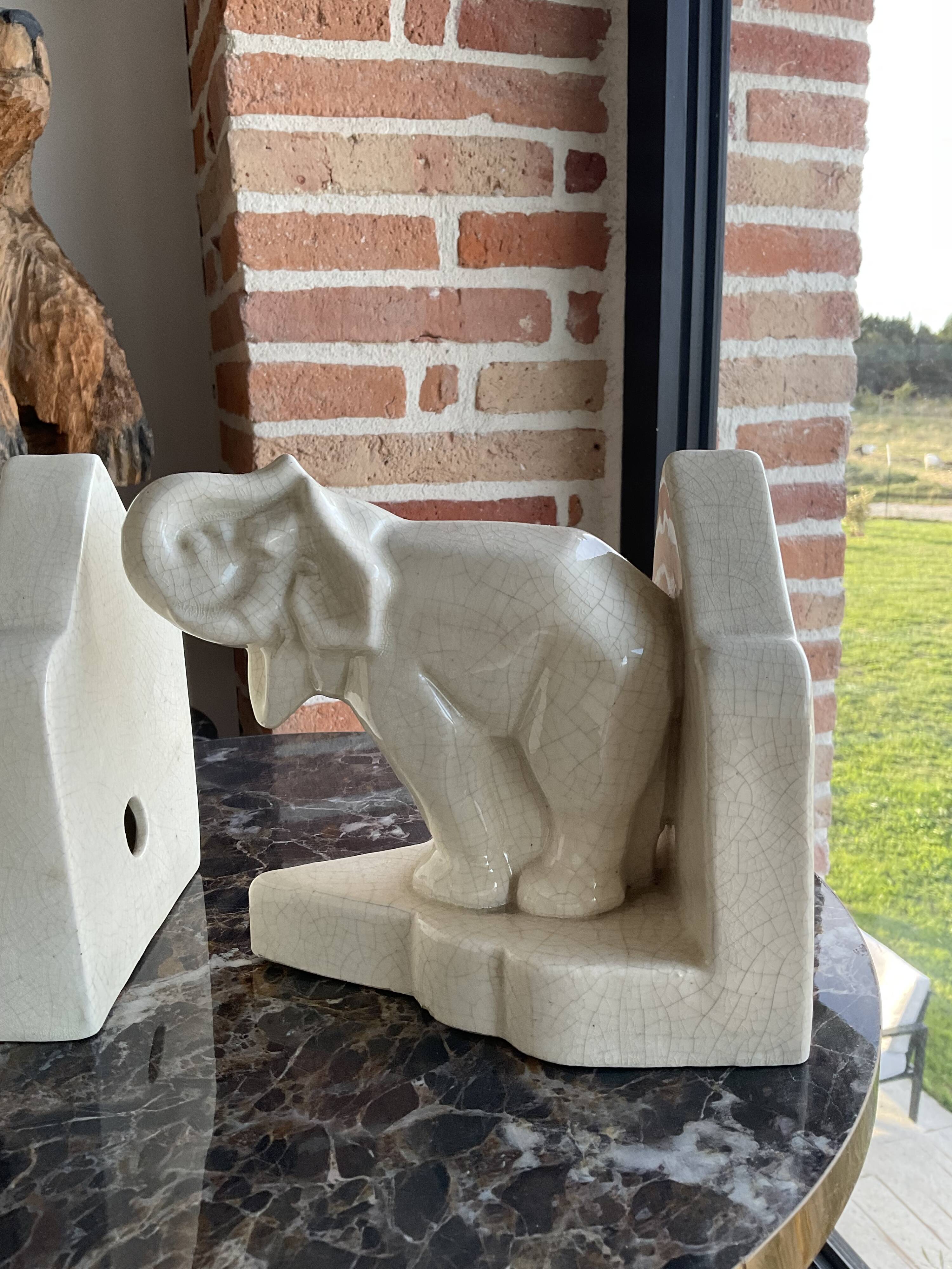 Pair of cracked earthenware bookends. ART DECO